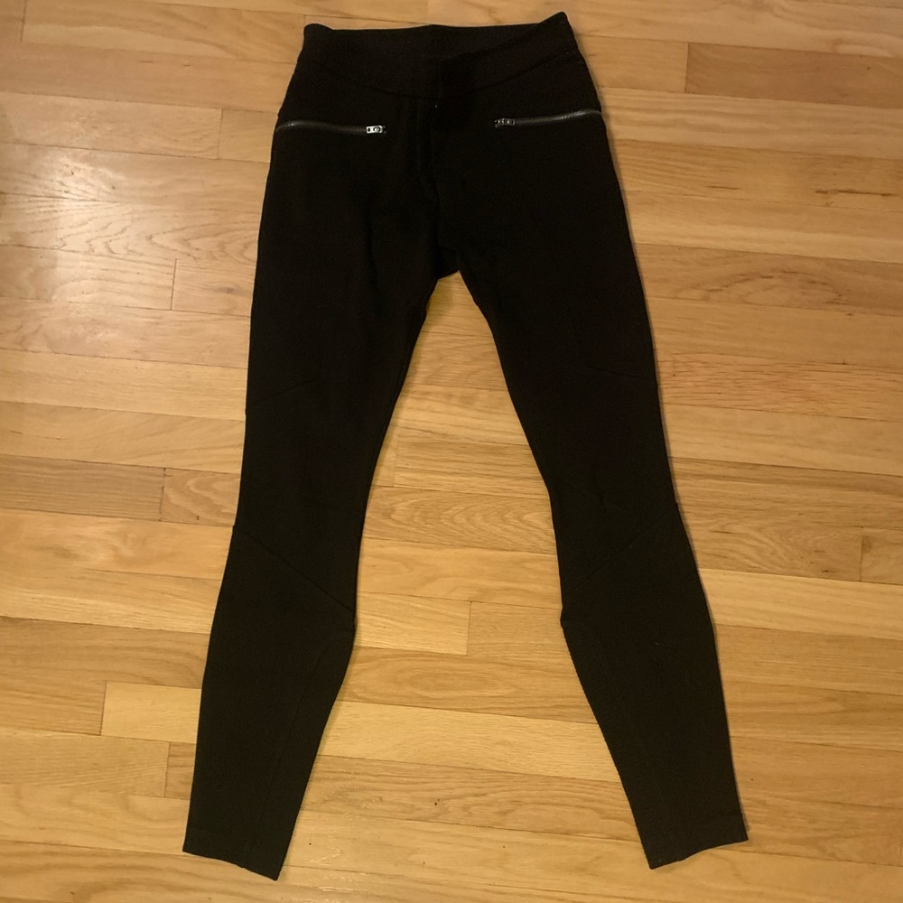 Like new! Athleta legging pant, black with gun metal zippers.